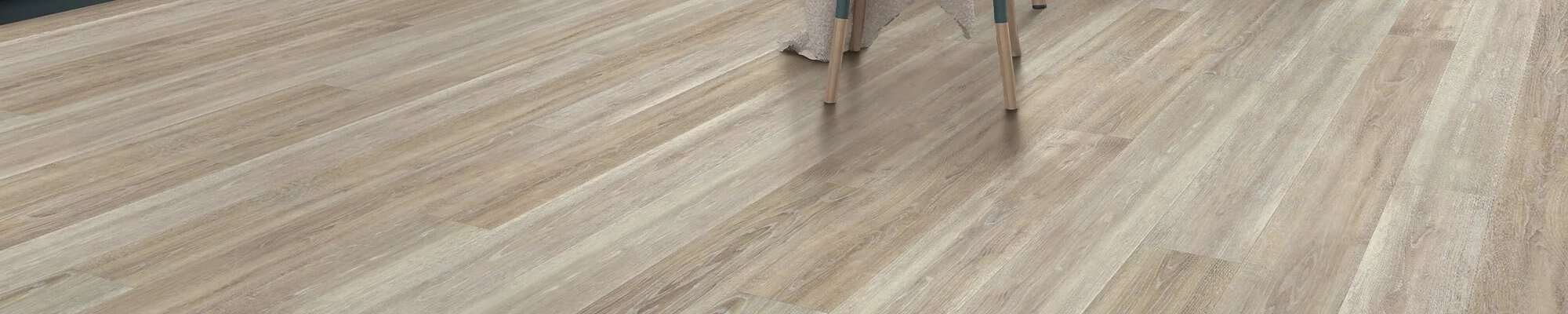 Woman choosing new flooring in the store from Coverings by Design in Washington, NC